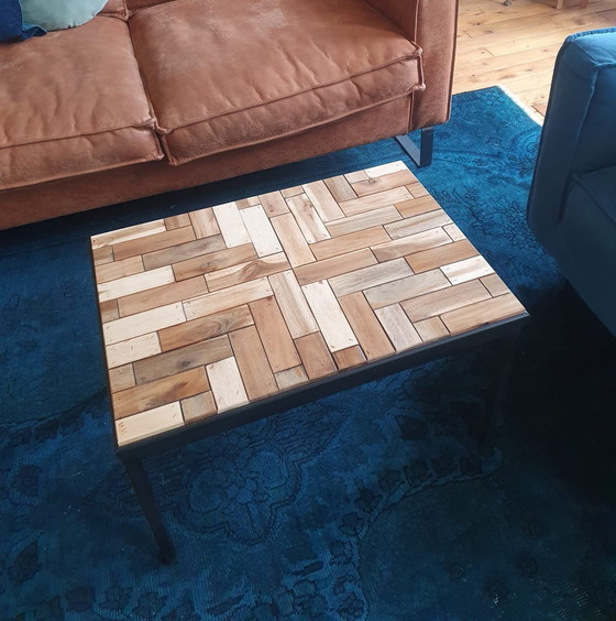 Image 1 of Coffee Table With Black Metal Frame And Inlaid With Reclaimed Wood In A Playful Motif