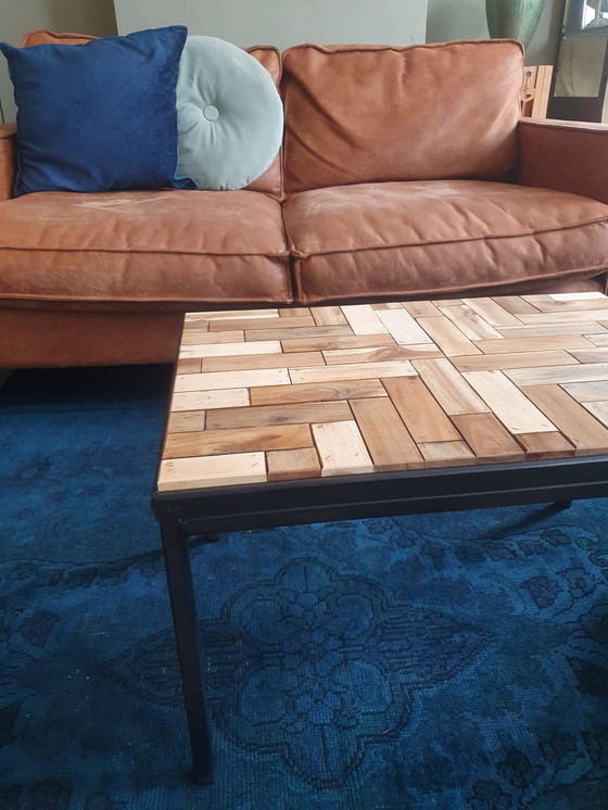 Image 1 of Coffee Table With Black Metal Frame And Inlaid With Reclaimed Wood In A Playful Motif