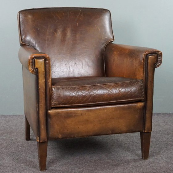 Image 1 of sheep leather armchair with a positive lived-in character