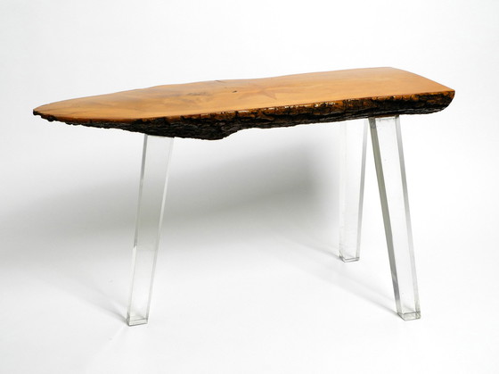 Image 1 of 1970s Regency design side coffee table made of a thick tree slice and with 3 plexiglass legs