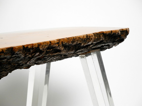 Image 1 of 1970s Regency design side coffee table made of a thick tree slice and with 3 plexiglass legs