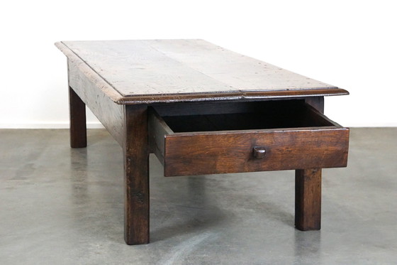 Image 1 of Large dark oak coffee table with drawer