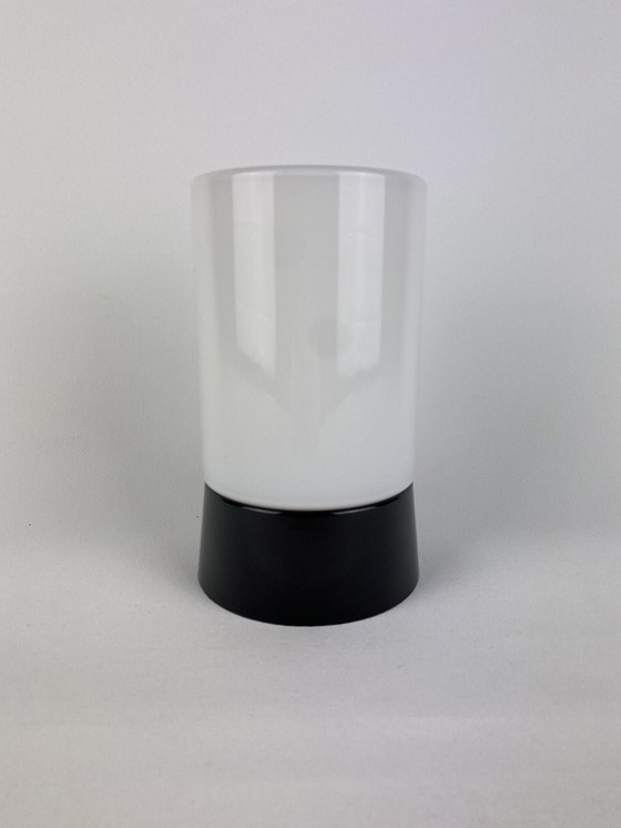 Image 1 of White cylindrical Art Deco Raak ceiling lamp with black fixture.
