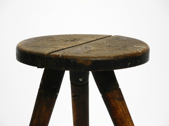 Image 1 of Solid 1930s three-legged industrial stool made of oak