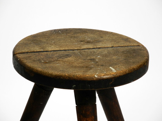 Image 1 of Solid 1930s three-legged industrial stool made of oak