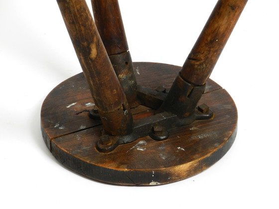 Image 1 of Solid 1930s three-legged industrial stool made of oak