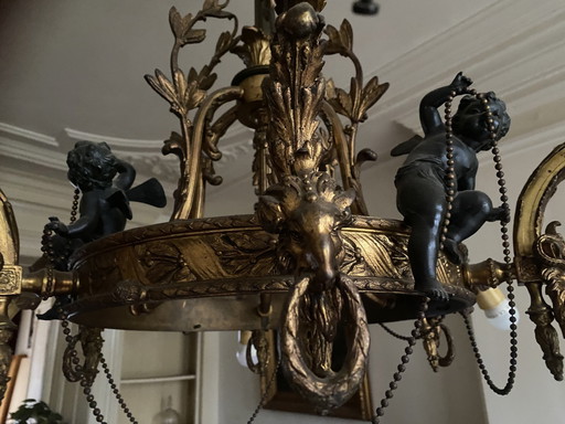 Antique Chandelier With Gorgeous Ornaments And Black Cherubs