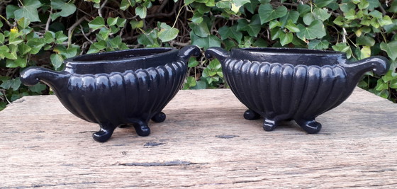 Image 1 of 2 Cast iron vases 27 cm wide