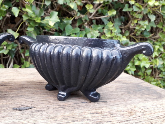 Image 1 of 2 Cast iron vases 27 cm wide