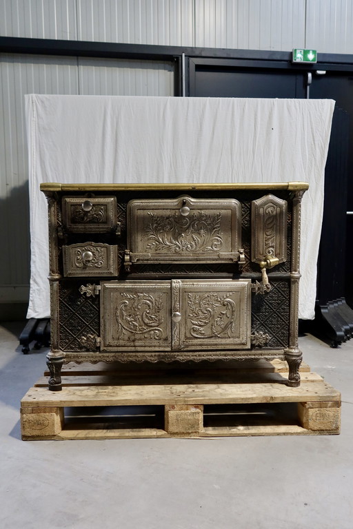 Antique cast-iron gas stove with glazed plates