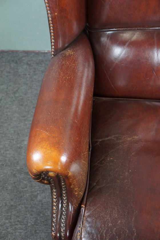 Image 1 of Warm brown sheepskin leather wing chair