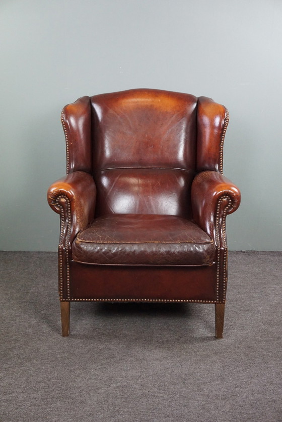 Image 1 of Warm brown sheepskin leather wing chair