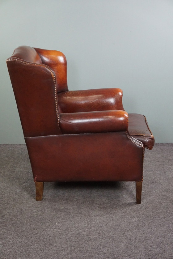 Image 1 of Warm brown sheepskin leather wing chair