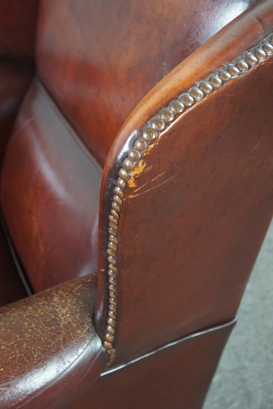 Image 1 of Warm brown sheepskin leather wing chair