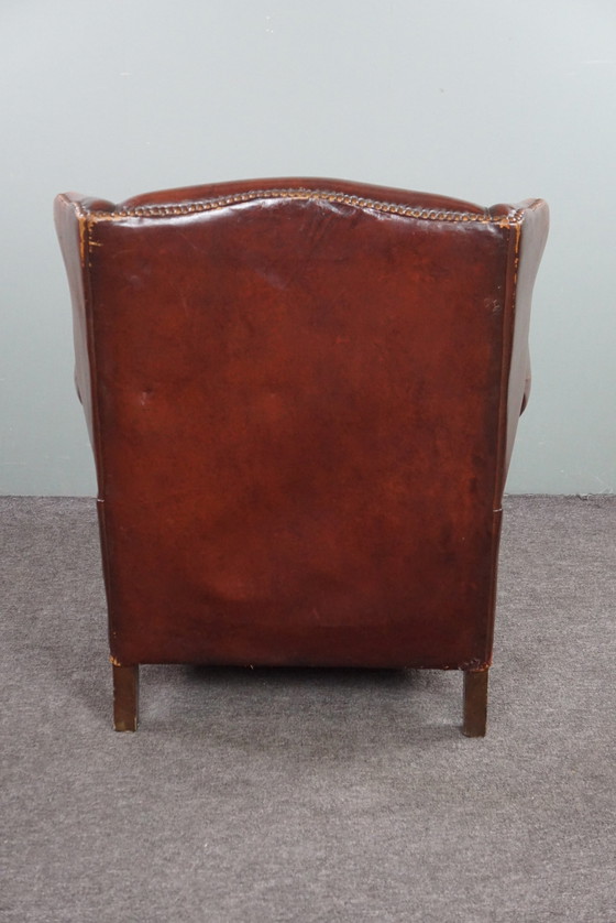 Image 1 of Warm brown sheepskin leather wing chair