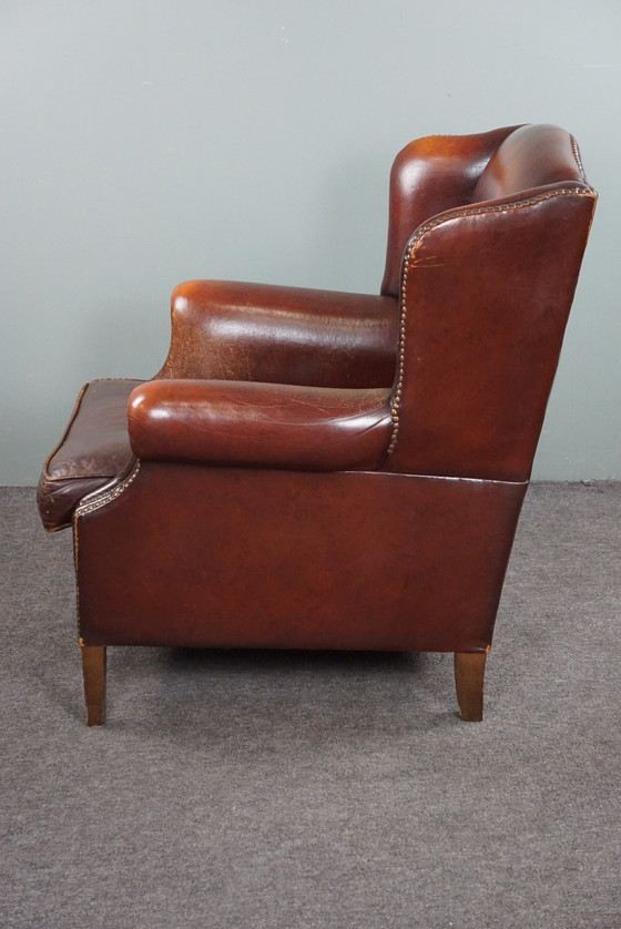 Image 1 of Warm brown sheepskin leather wing chair