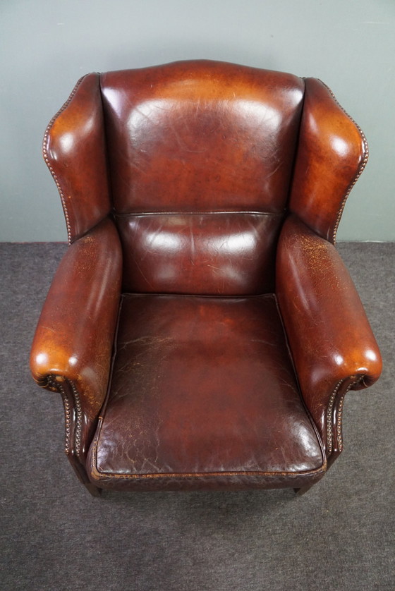 Image 1 of Warm brown sheepskin leather wing chair