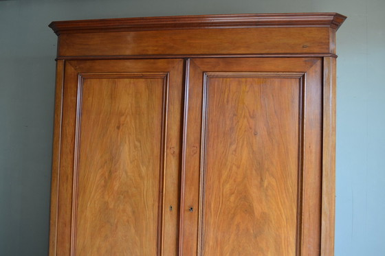 Image 1 of Large Sleek Antique Mahogany Cupboard.