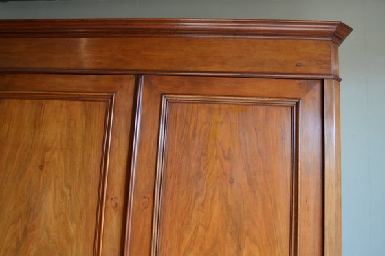 Image 1 of Large Sleek Antique Mahogany Cupboard.