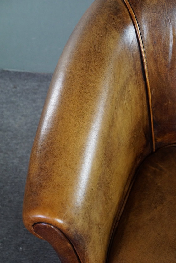 Image 1 of Sheep leather club chair, in good condition