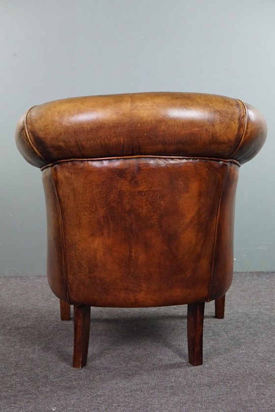 Image 1 of Sheep leather club chair, in good condition