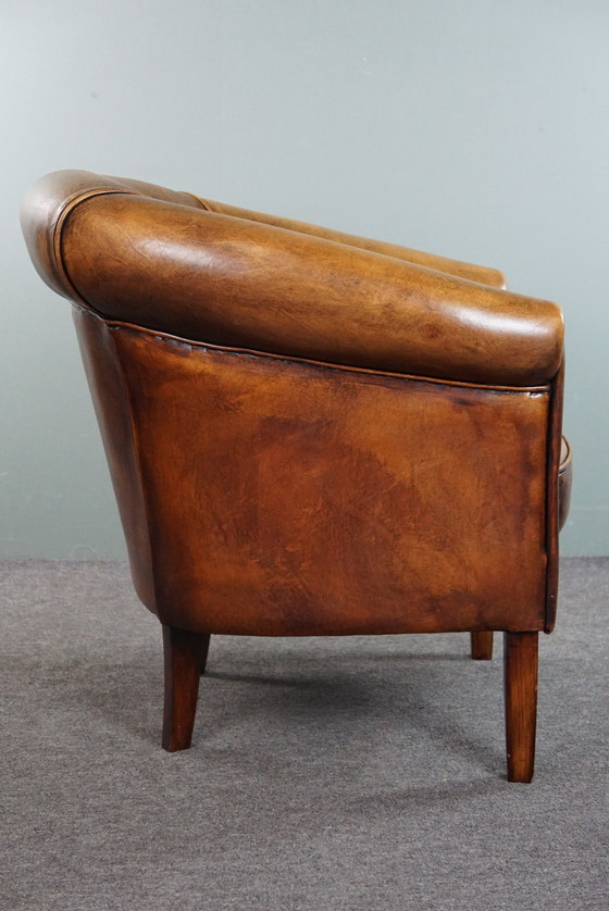 Image 1 of Sheep leather club chair, in good condition