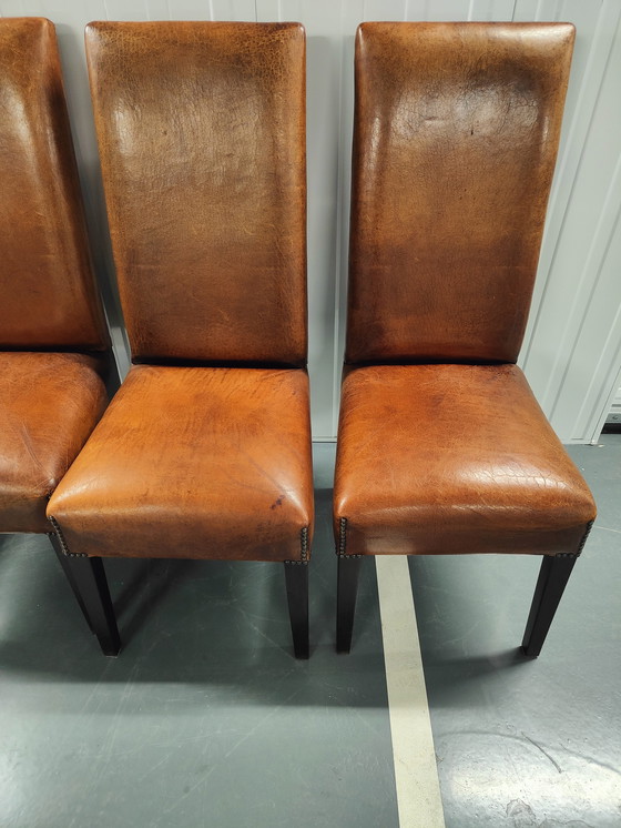 Image 1 of 4x Sheep leather chairs and wood legs