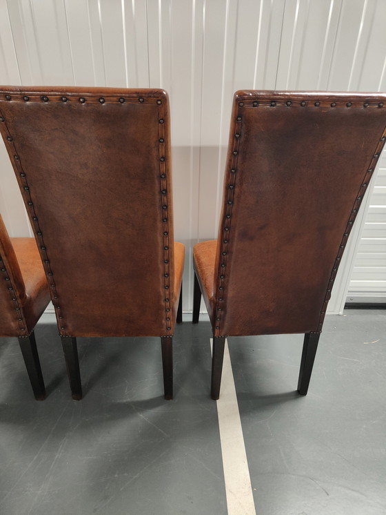 Image 1 of 4x Sheep leather chairs and wood legs