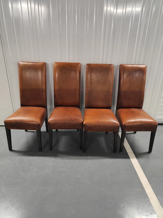 Image 1 of 4x Sheep leather chairs and wood legs