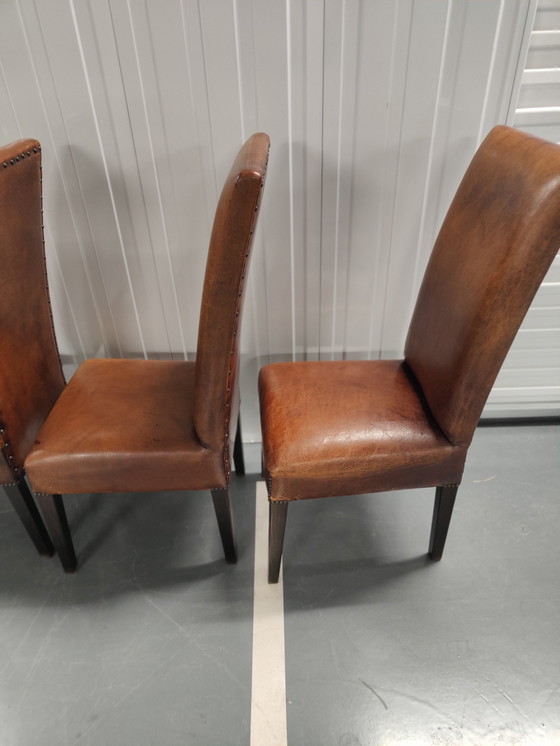 Image 1 of 4x Sheep leather chairs and wood legs