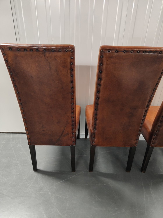 Image 1 of 4x Sheep leather chairs and wood legs