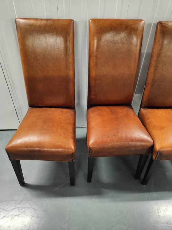 Image 1 of 4x Sheep leather chairs and wood legs