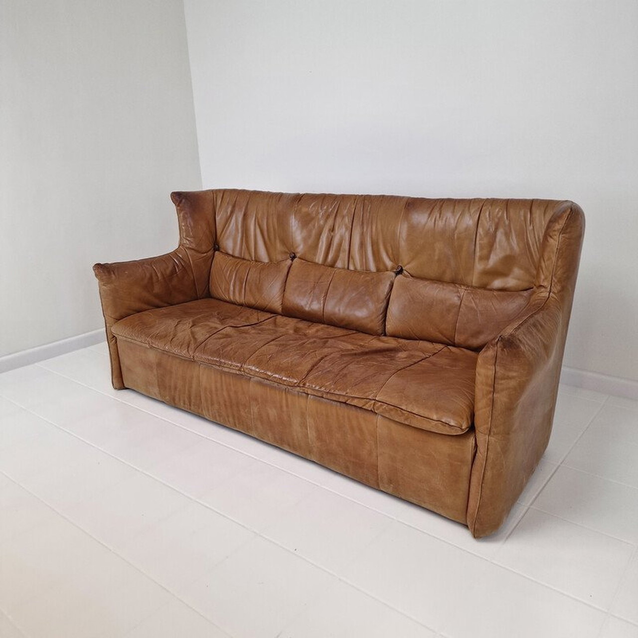 Vintage high back sofa in cognac leather by Gerard van den Berg