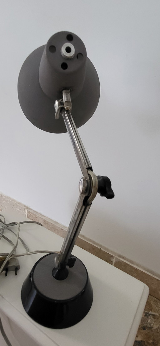 old grey articulated desk lamp