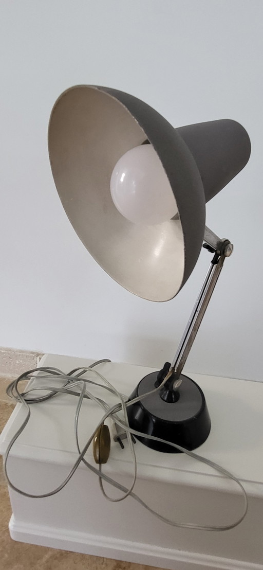 old grey articulated desk lamp