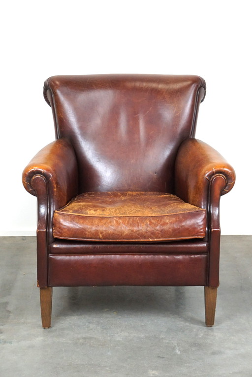 Sheep leather armchair with patina