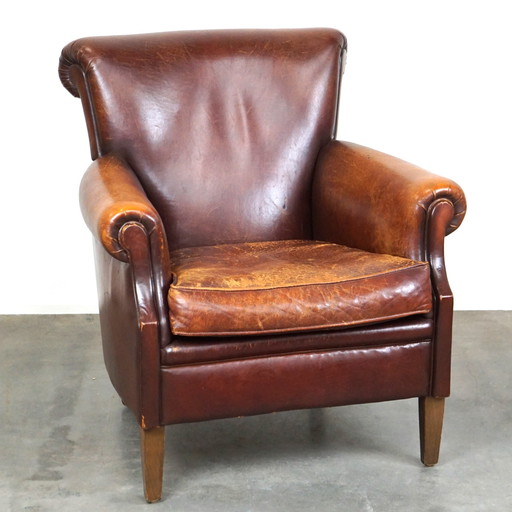 Sheep leather armchair with patina