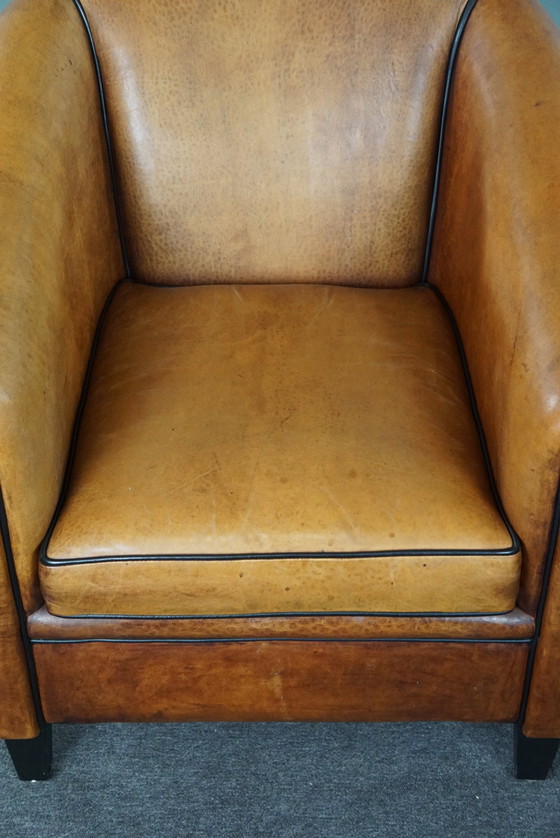 Image 1 of Light sheep leather club chair with black piping