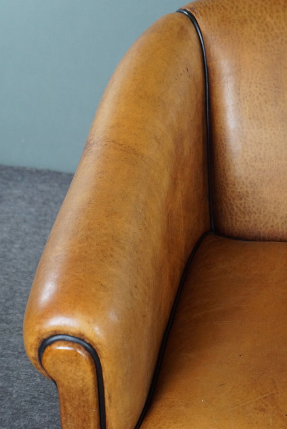 Image 1 of Light sheep leather club chair with black piping