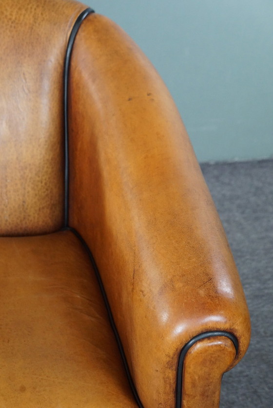 Image 1 of Light sheep leather club chair with black piping