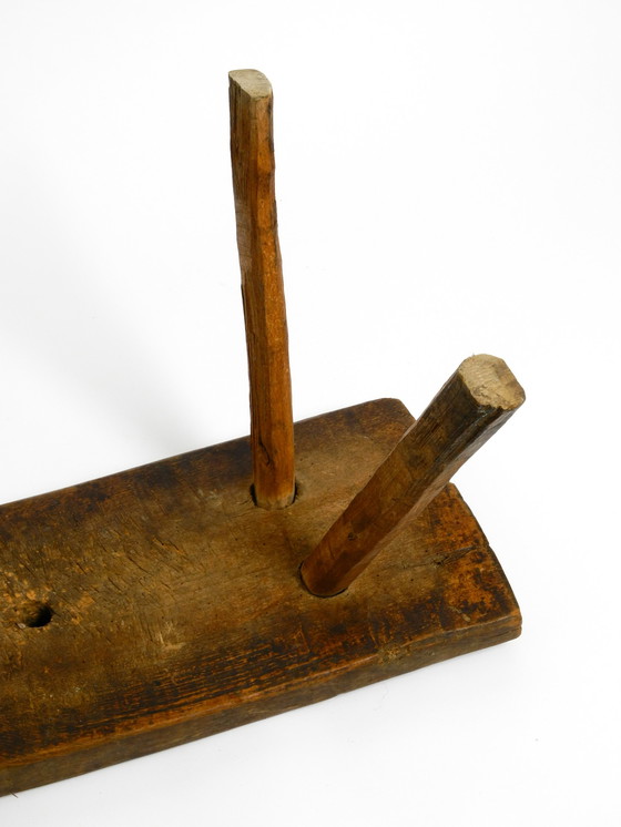 Image 1 of Oblong four-legged original Mid Century solid wood stool with a gorgeous patina