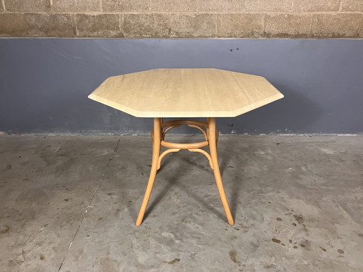 Table en travertin avec pied en bentwood