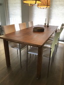 6x Modern white leather dining chairs with chrome tubular frame.