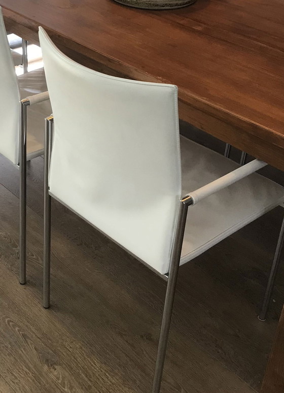 Image 1 of 6x Modern white leather dining chairs with chrome tubular frame.