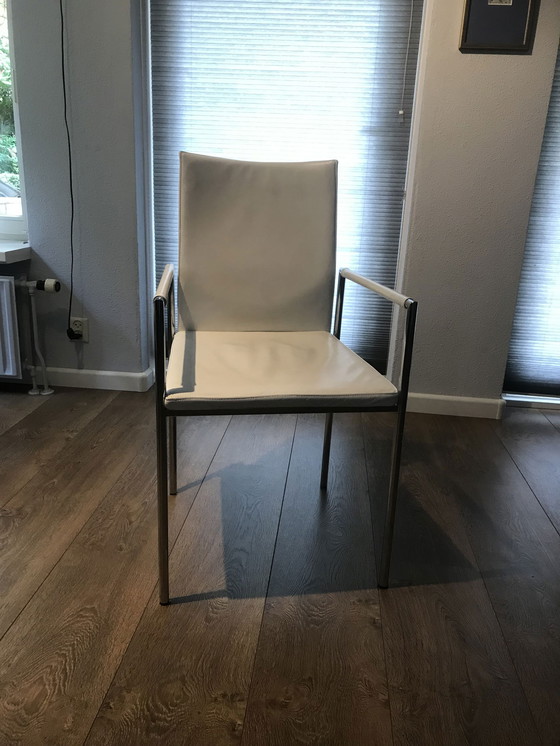 Image 1 of 6x Modern white leather dining chairs with chrome tubular frame.