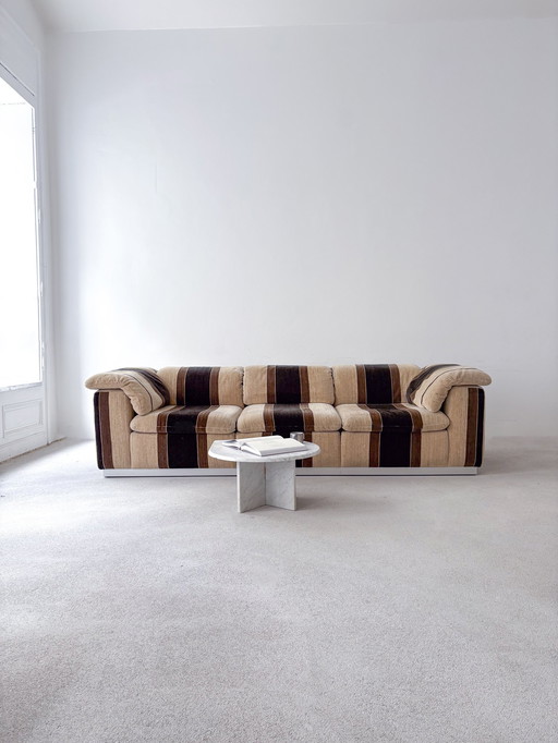 Dreamy Long 70S designer sofa with stainless steel frame in brown tones | Bauhaus