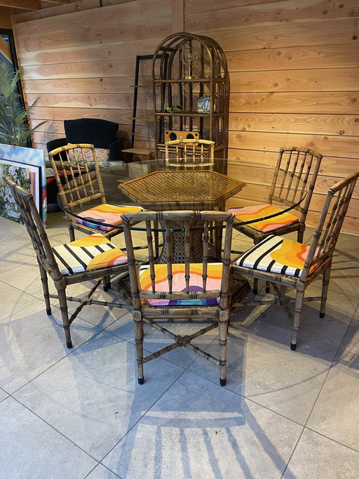 1Glass Dining Table With A Rattan Frame And 6 Matching Dining Chairs