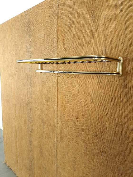 Image 1 of Appendiabiti da parete Train color oro con ganci e ripiano, n. 1