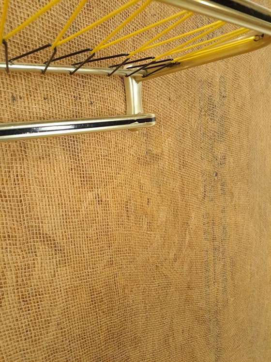 Image 1 of Appendiabiti da parete Train color oro con ganci e ripiano, n. 1