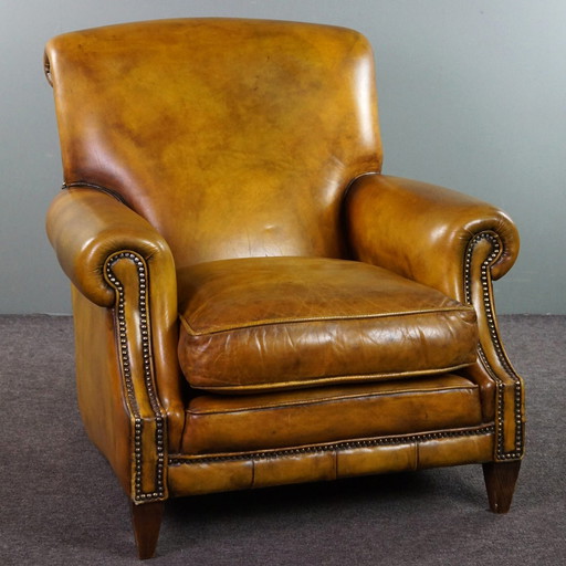 Grand fauteuil à roulettes en cuir de vachette